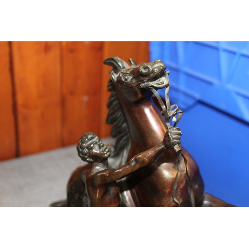 105 - A pair of bronze Marley horses, 10 1/2