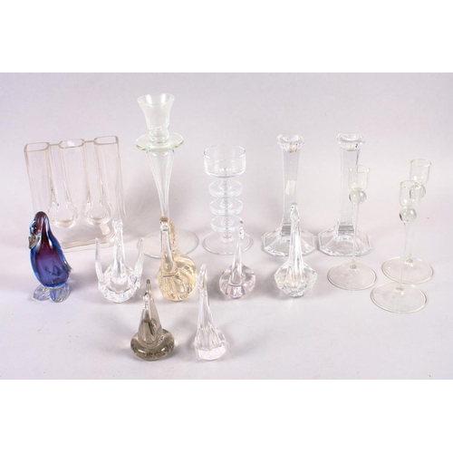 18 - A pair of modernist glass candlesticks, a Wedgwood glass candlestick, a number of glass swans and ot... 