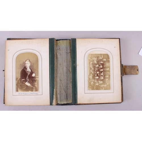 225 - A 19th century carte de visite album with inset abalone and gilt borders, a 1930s photograph album, ... 