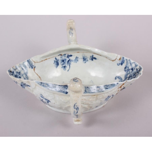 1 - An 18th century English blue and white porcelain two-handle sauce boat (heavily restored)