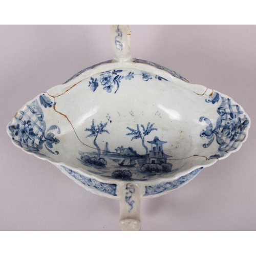 1 - An 18th century English blue and white porcelain two-handle sauce boat (heavily restored)