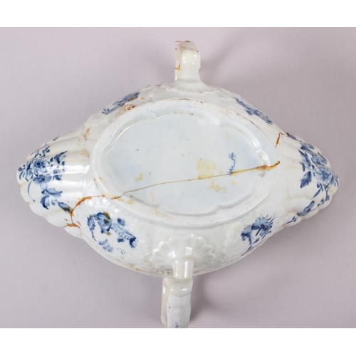 1 - An 18th century English blue and white porcelain two-handle sauce boat (heavily restored)