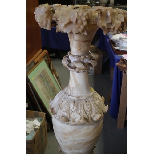 103 - A 19th century Italian sectional carved alabaster vase, on fluted base, 50