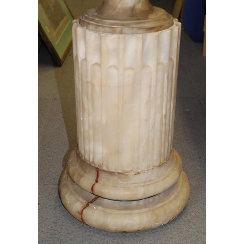 103 - A 19th century Italian sectional carved alabaster vase, on fluted base, 50