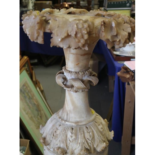 103 - A 19th century Italian sectional carved alabaster vase, on fluted base, 50