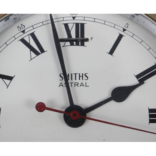 105 - A Smiths Astral bulkhead clock with Roman numerals, in brass case, 6 3/4