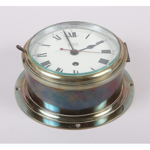 105 - A Smiths Astral bulkhead clock with Roman numerals, in brass case, 6 3/4