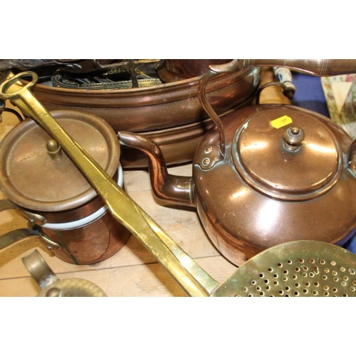 119 - A 19th century copper kettle, a brass cream skimmer, a brass kettle stand and other metalwares