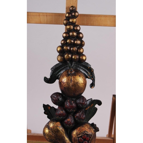 140 - A carved wood cornucopia with fruit and ribbon, 19