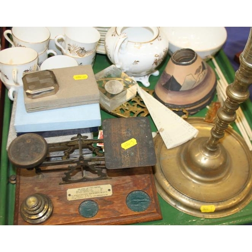 200 - A 19th century gilt decorated part teaset, a set of postal scales and weights, a brass candlestick, ... 