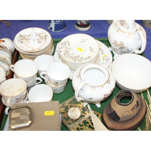 200 - A 19th century gilt decorated part teaset, a set of postal scales and weights, a brass candlestick, ... 