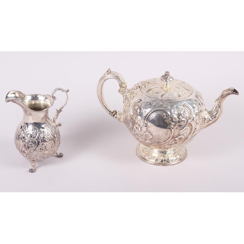 246 - A Victorian Scottish silver teapot with embossed Rococo decoration, Marshall & Sons, Edinburgh 1848,... 