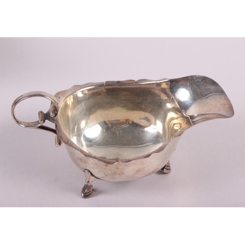 249 - A silver pedestal sauce boat with gadrooned border and a smaller silver sauce boat, 12.3oz troy appr... 