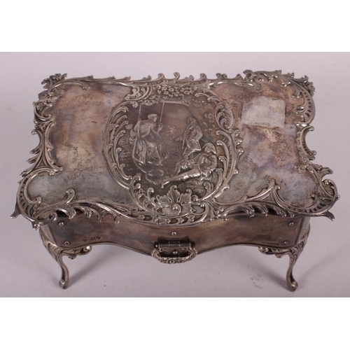 261 - A silver jewellery box, in the form of a dressing table fitted one drawer and with embossed decorati... 