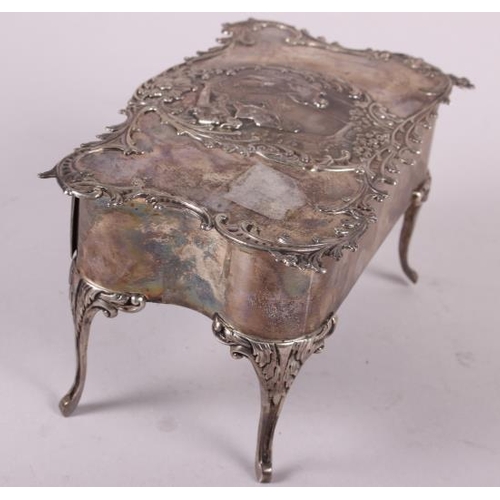 261 - A silver jewellery box, in the form of a dressing table fitted one drawer and with embossed decorati... 