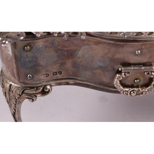 261 - A silver jewellery box, in the form of a dressing table fitted one drawer and with embossed decorati... 