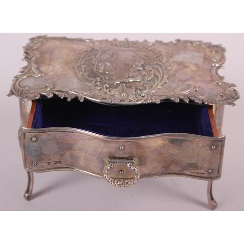 261 - A silver jewellery box, in the form of a dressing table fitted one drawer and with embossed decorati... 