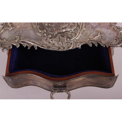 261 - A silver jewellery box, in the form of a dressing table fitted one drawer and with embossed decorati... 