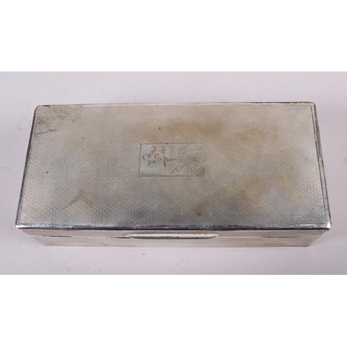 264 - A silver cigarette box with engine turned decoration, 7 1/2