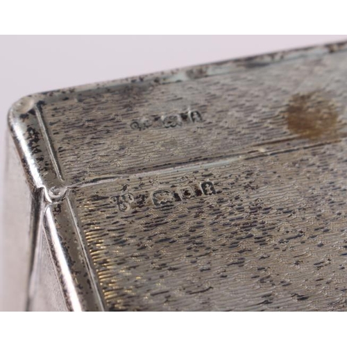 264 - A silver cigarette box with engine turned decoration, 7 1/2