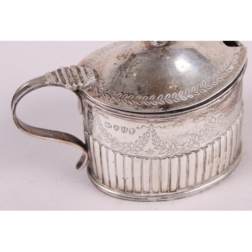 265 - A Victorian silver oval mustard pot with half fluted and engraved decoration and blue glass liner, 3... 