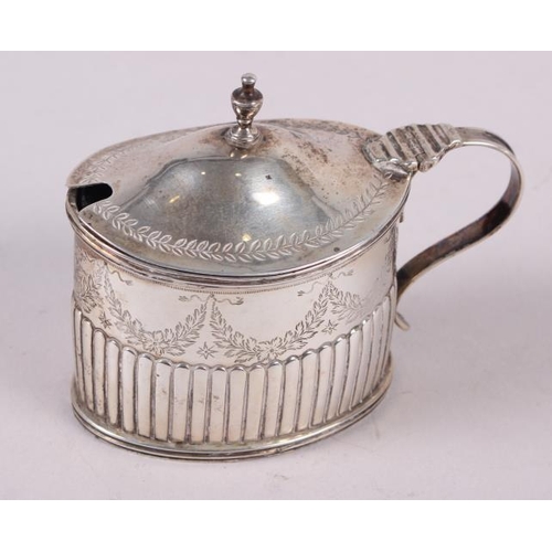 265 - A Victorian silver oval mustard pot with half fluted and engraved decoration and blue glass liner, 3... 