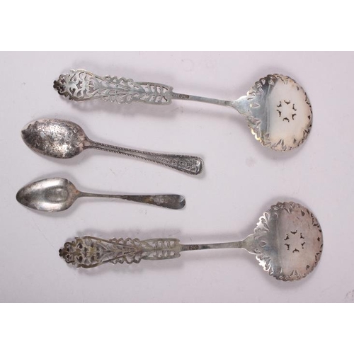 269 - A pair of silver fruit servers with pierced and engraved decoration and two silver spoons, 5.9oz tro... 