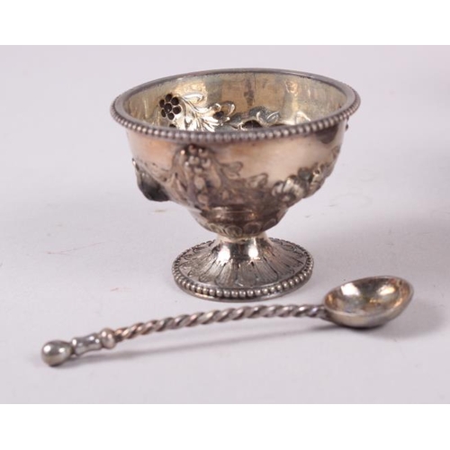 274 - A set of six Victorian silver salts and spoons with embossed decoration, in fitted case, 7.1oz troy ... 