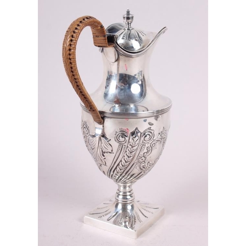 282 - A silver water jug with embossed decoration and caned handle, 11.4oz troy approx