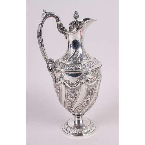 283 - A silver water jug with embossed decoration, 29.4oz troy approx