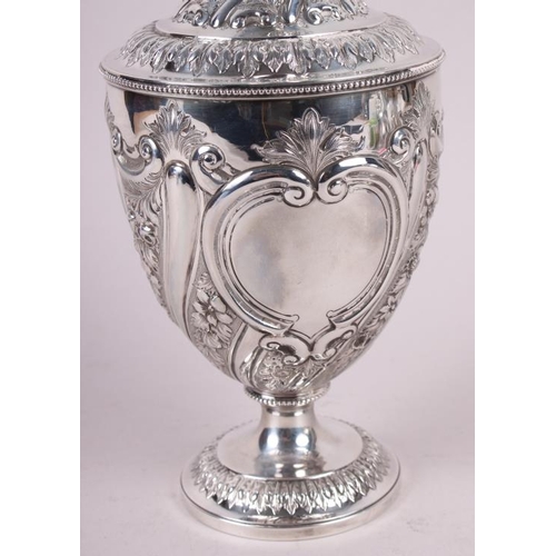 283 - A silver water jug with embossed decoration, 29.4oz troy approx