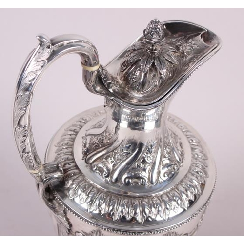 283 - A silver water jug with embossed decoration, 29.4oz troy approx