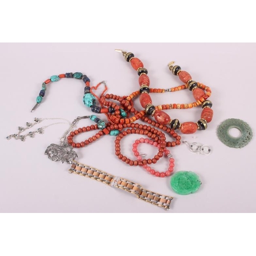 289 - A collection of coral bead necklaces, a carved jade pendant and other jewellery