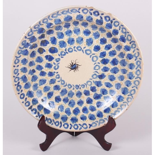 3 - An 18th century Delft plate with all-over leaf and tendril design, 12