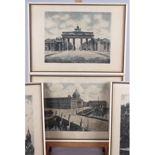 335 - Four Continental colour prints of buildings, indistinctly signed, in white and gilt frames