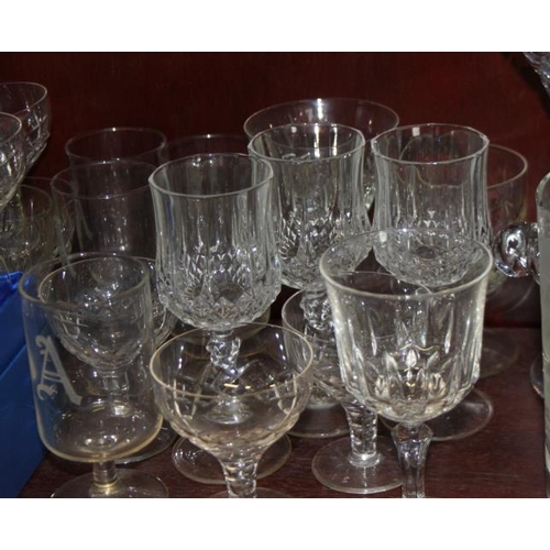 44 - An etched glass ice bucket, vases, whisky tumblers, ashtrays and other glassware