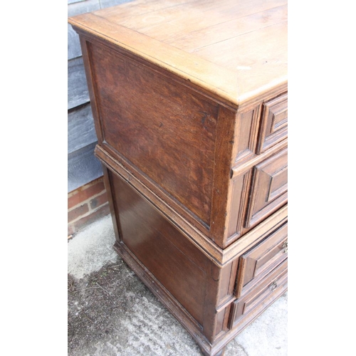 449 - An 18th century oak chest of four long drawers with fielded panel fronts and brass handles, on bun f... 