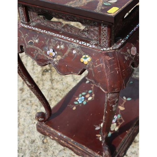 455 - A late 19th century Chinese lacquer, stone, mother-of-pearl and enamel decorated two-tier table, on ... 