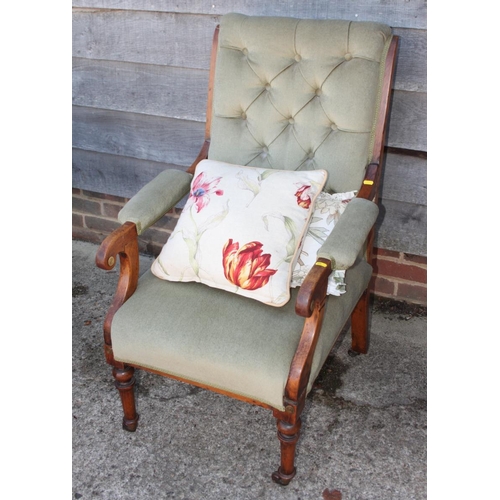 460 - A late 19th century polished as walnut scroll arm chair, upholstered in a sage green fabric, on turn... 