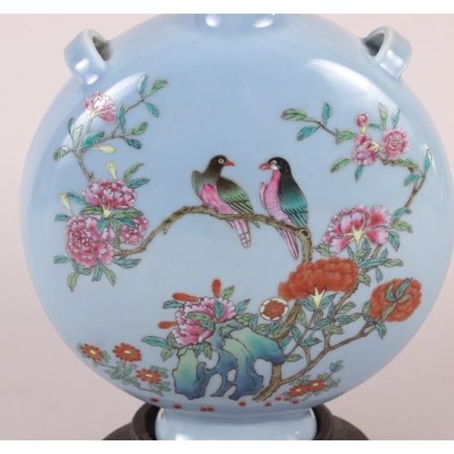 63 - A Chinese moon flask with famille rose decoration of birds and flora, 9 1/2