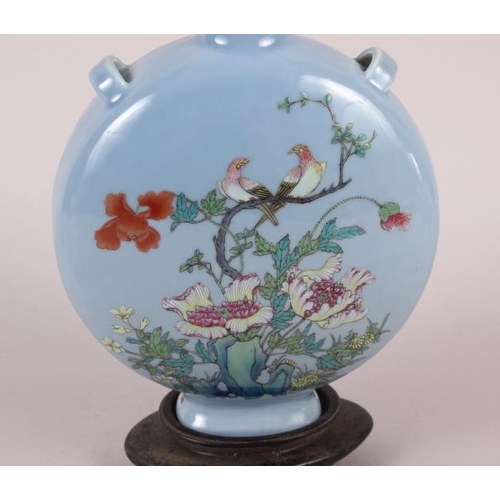 63 - A Chinese moon flask with famille rose decoration of birds and flora, 9 1/2