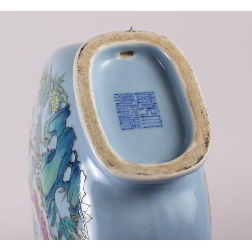 63 - A Chinese moon flask with famille rose decoration of birds and flora, 9 1/2