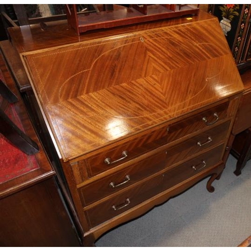 630 - A 1930s walnut fall front bureau, on cabriole supports, 31