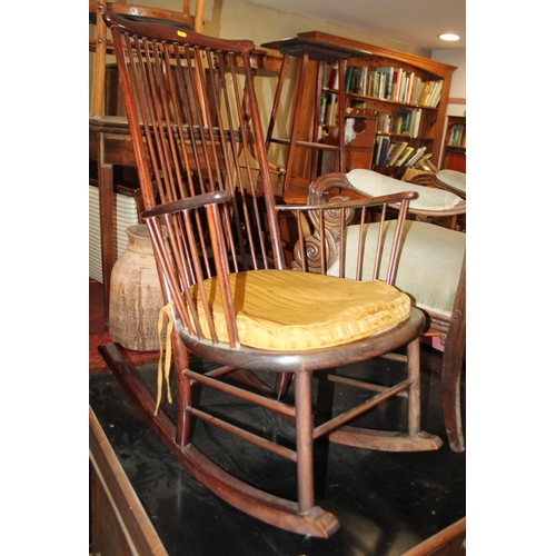 636 - A modern stick back rocking chair and a mahogany wine table, 16