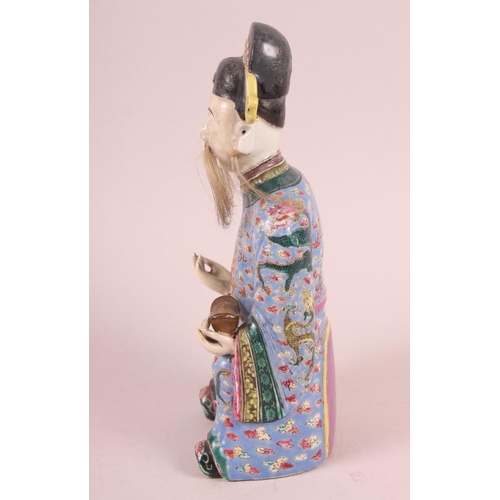 64 - A Canton enamel figure of the God of Fortune, 10