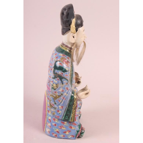 64 - A Canton enamel figure of the God of Fortune, 10