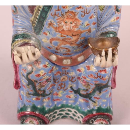 64 - A Canton enamel figure of the God of Fortune, 10