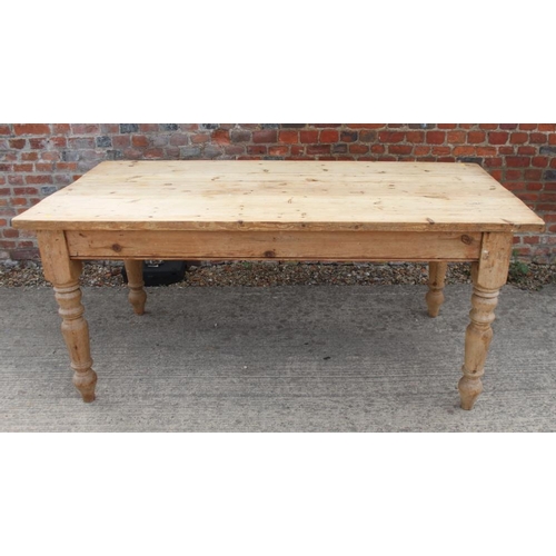 652 - A pine scrub top kitchen table, on turned supports, top 35