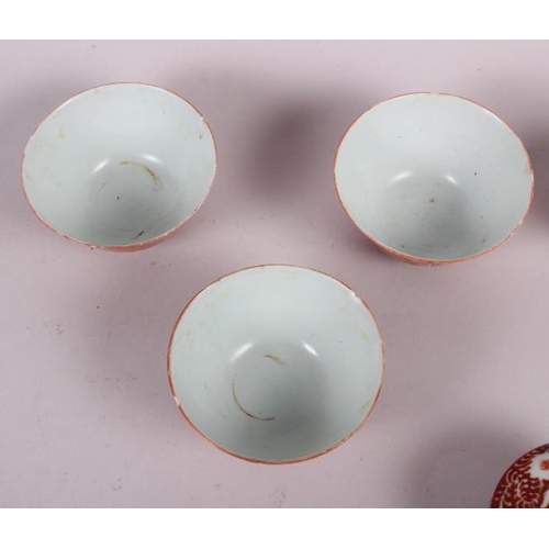 66 - Three Chinese orange glazed tea bowls with seal marks to base, two pairs of tea bowls, and another t... 