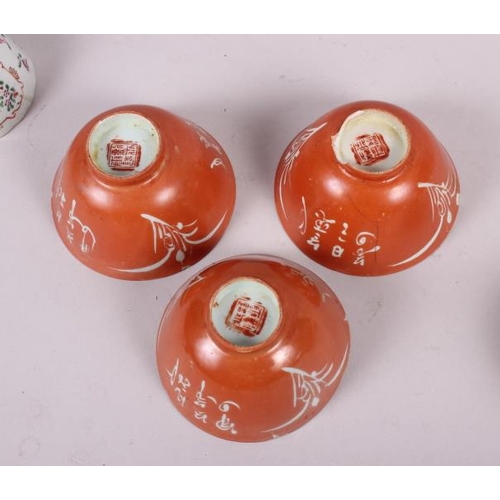 66 - Three Chinese orange glazed tea bowls with seal marks to base, two pairs of tea bowls, and another t... 